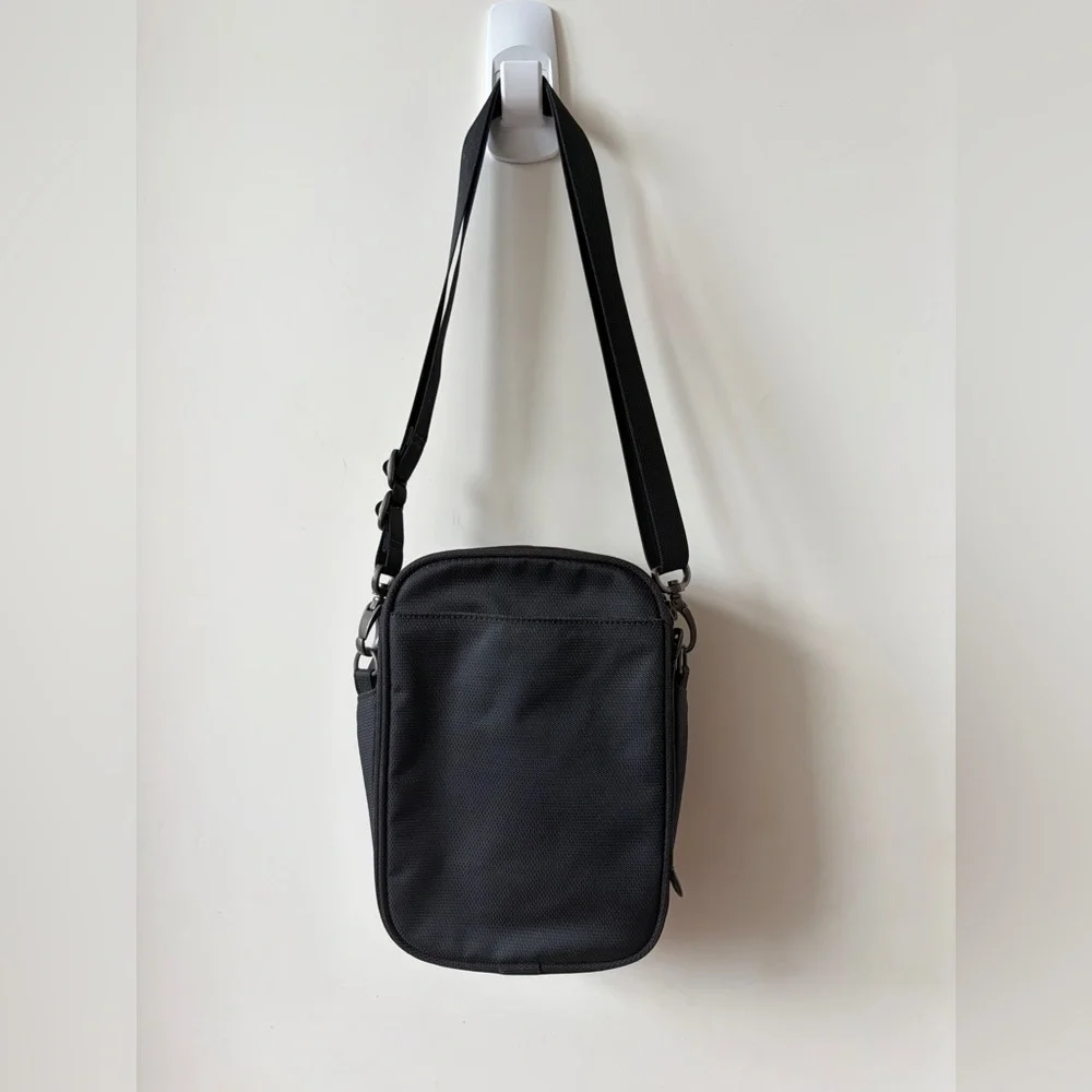 Tumi T-Tech sling bag with multiple compartments and Keychain mens